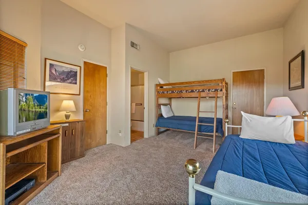 a bed room with a bed and furniture