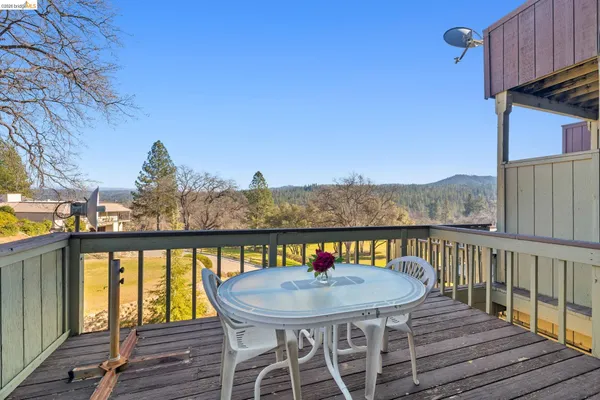 a view of a balcony with furniture