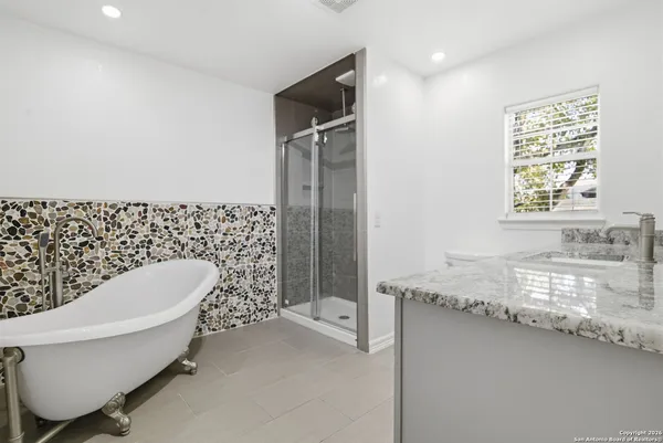a bathroom with a sink and a bathtub