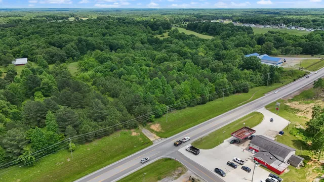 a view of a yard with a table and chair