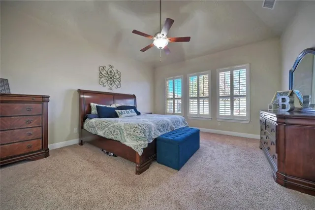 a living room with furniture a fireplace and a chandelier