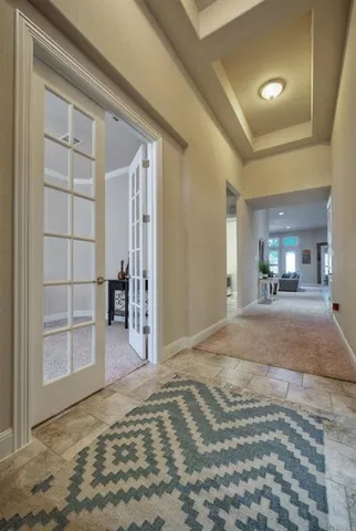 a view of a room with a bedroom and wooden floor