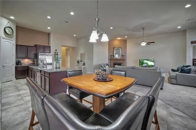 a large kitchen with stainless steel appliances lots of counter top space