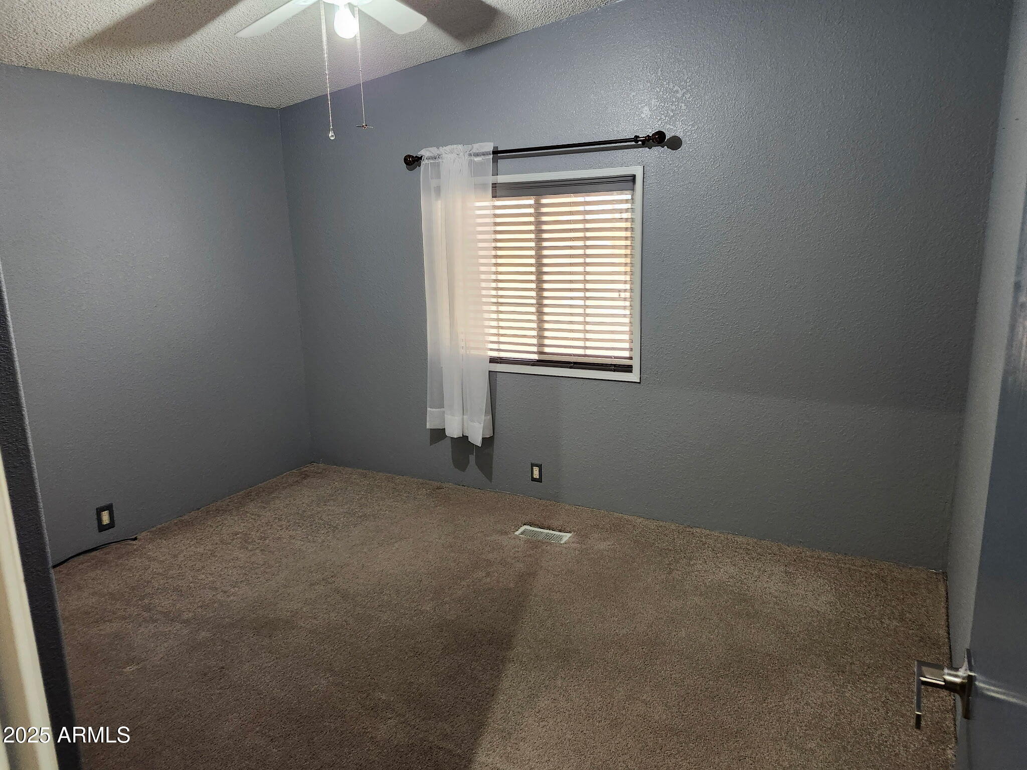 3700 South Tomahawk Road, Unit 18 Apache Junction, AZ 85119 - Photo 12 of 21 an empty room with a window