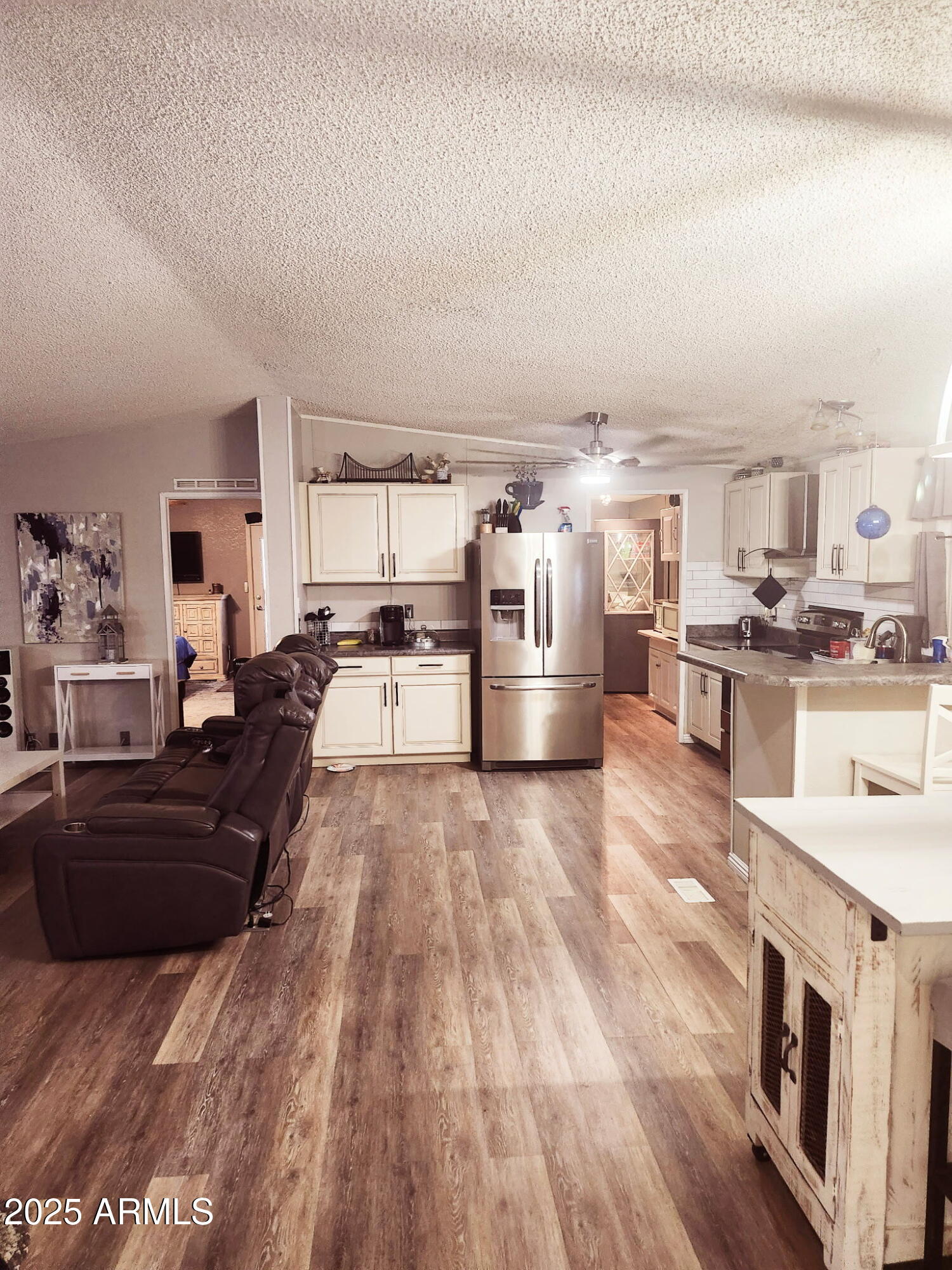 3700 South Tomahawk Road, Unit 18 Apache Junction, AZ 85119 - Photo 3 of 21 a large kitchen with stainless steel appliances and a stove top oven