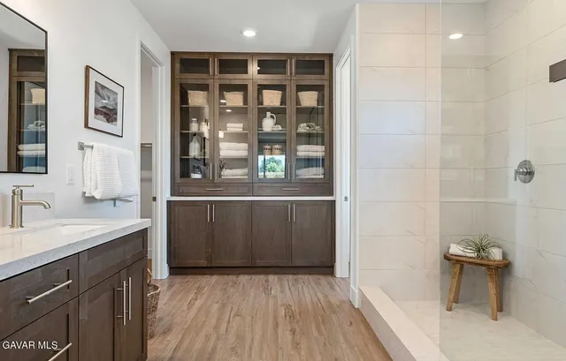 a bathroom with a sink and a mirror