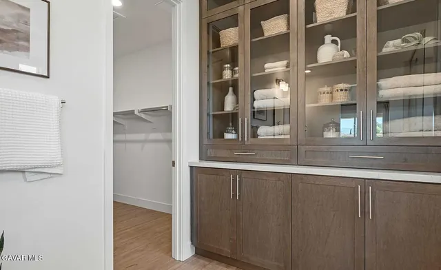 a view of a kitchen from a hallway