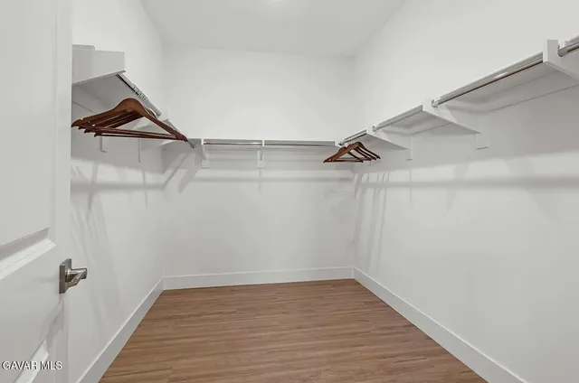 a view of a room with racks on the wall