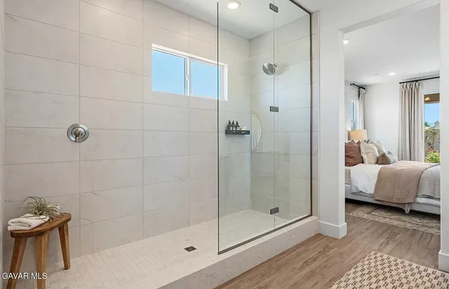 a bathroom with a bathtub and a shower