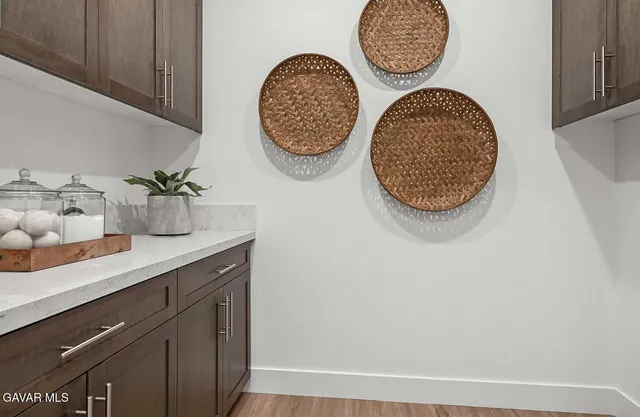 a bathroom with a mirror and a sink