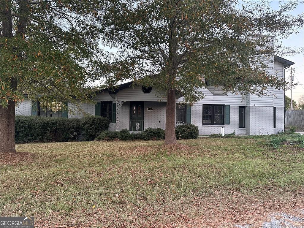 2363 Alvin Joiner Road Dublin, GA 31021 - Photo 25 of 35 a front view of a house with a garden