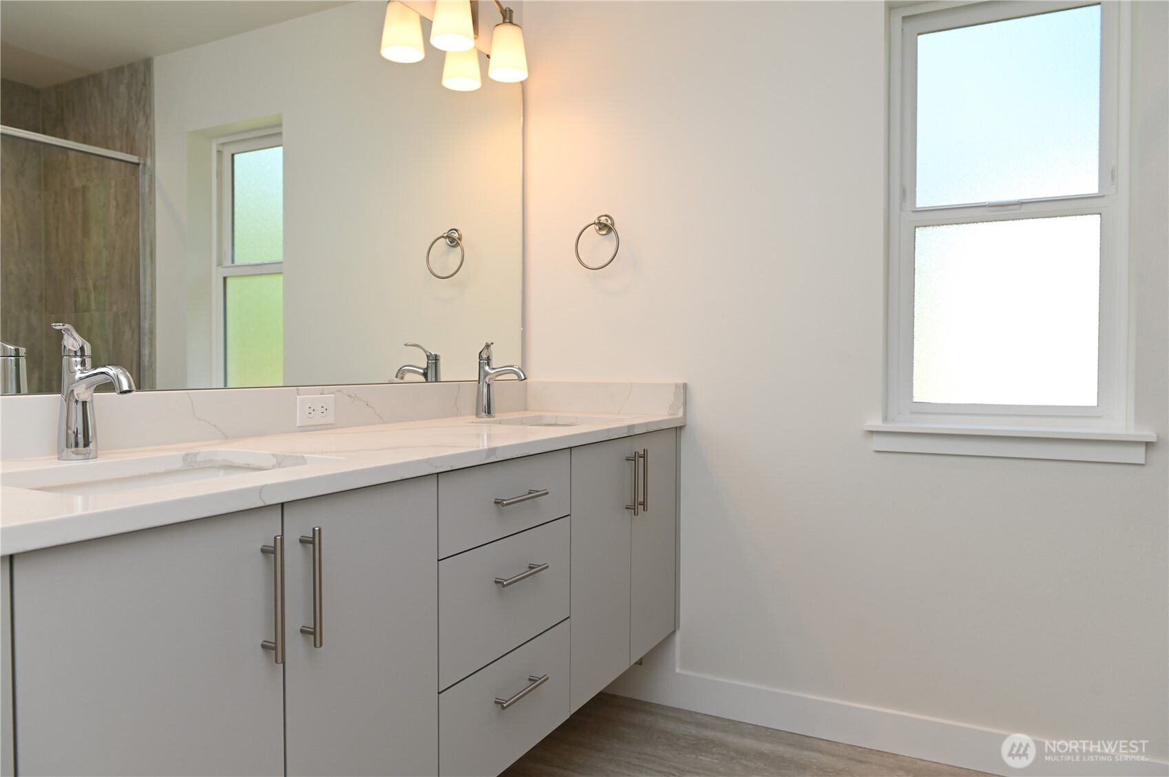 1323 Roland Street Bellingham, WA 98229 - Photo 13 of 16 a bathroom with a double vanity sink and a mirror