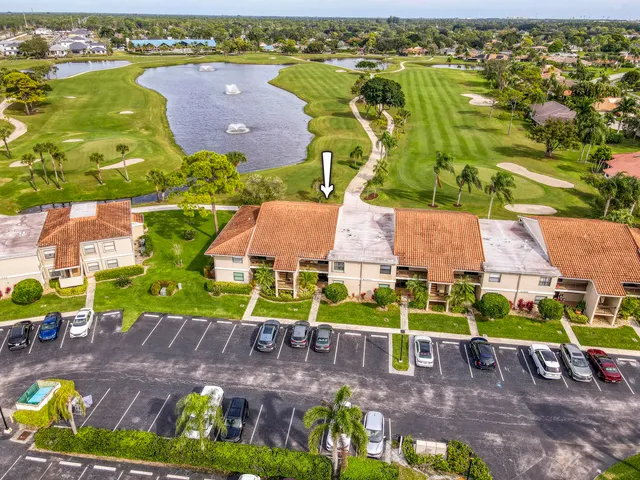 an aerial view of a house with a swimming pool yard and outdoor seating