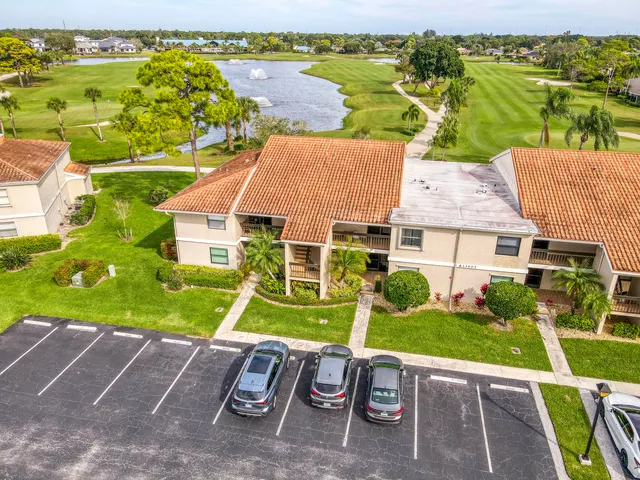 an aerial view of a house with a yard basket ball court and outdoor seating