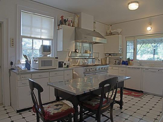 2856 South Lowden Road Oregon, IL 61061 - Photo 4 of 8 a kitchen with a table chairs stove and cabinets