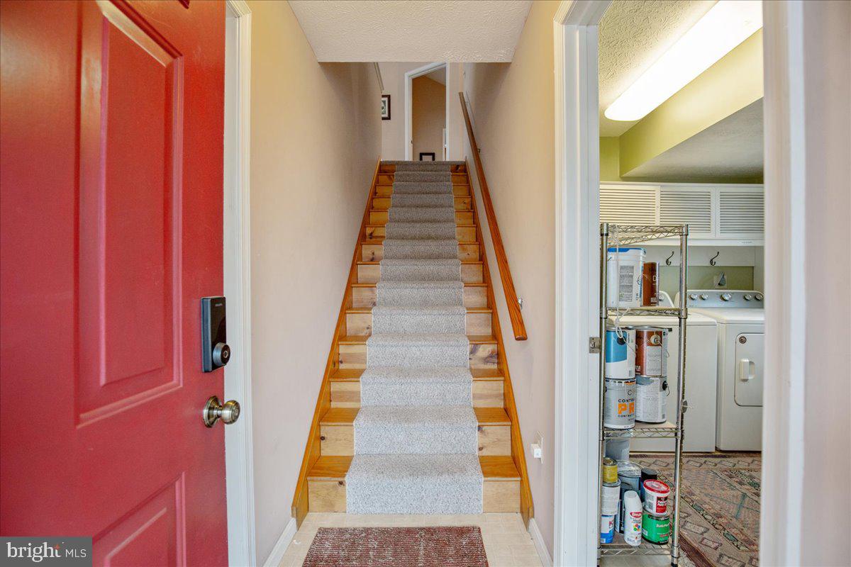 14382 Sedwick Avenue Solomons, MD 20688 - Photo 67 of 90 Stairs to 2BR/1BA apt, laundry-utilities for bldg