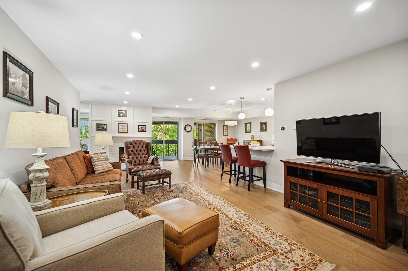 3801 Mission Hills Road, Unit 510 Northbrook, IL 60062 - Photo 4 of 19 a living room with furniture and a flat screen tv