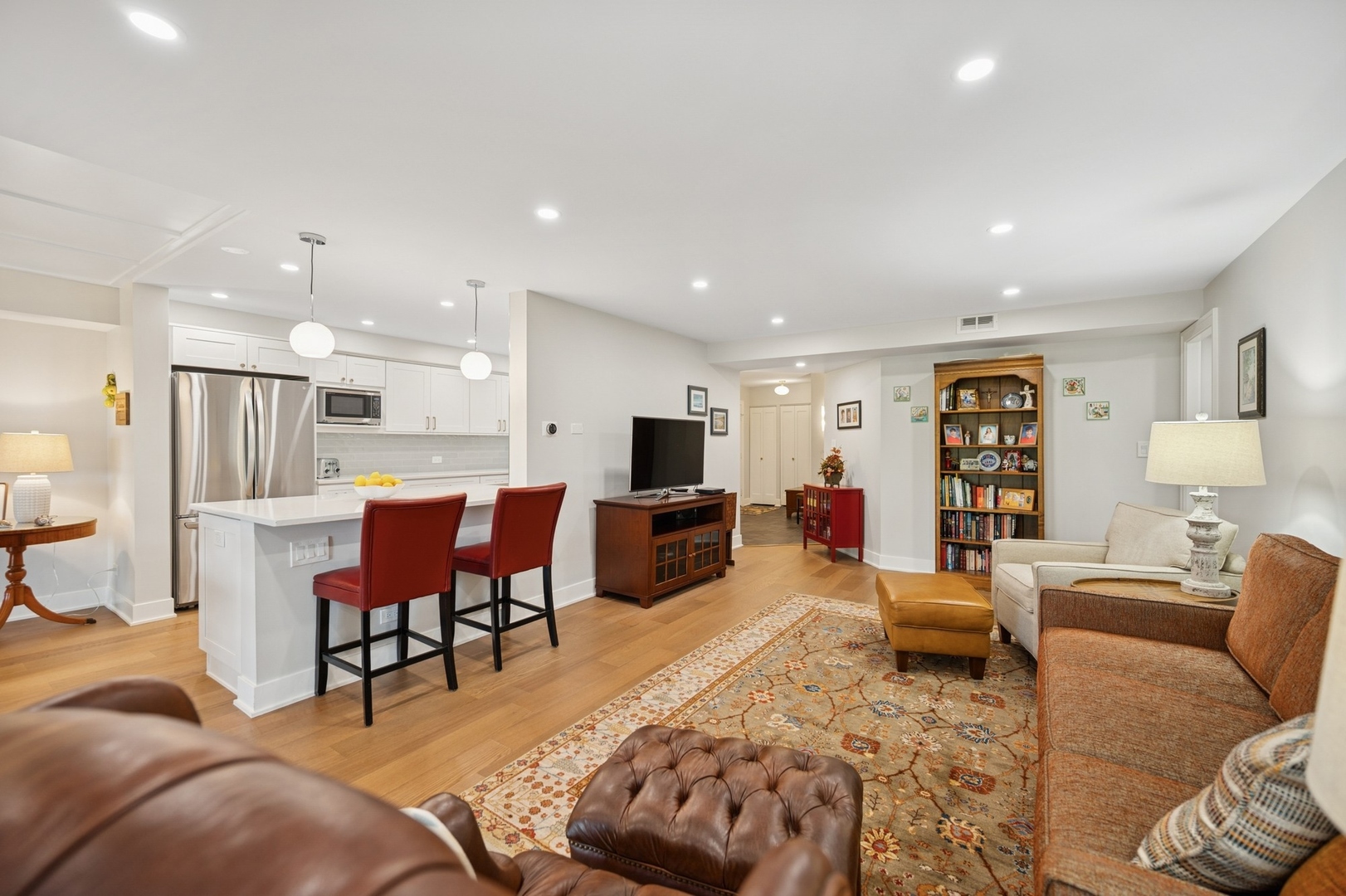 3801 Mission Hills Road, Unit 510 Northbrook, IL 60062 - Photo 5 of 19 a living room with furniture and a flat screen tv
