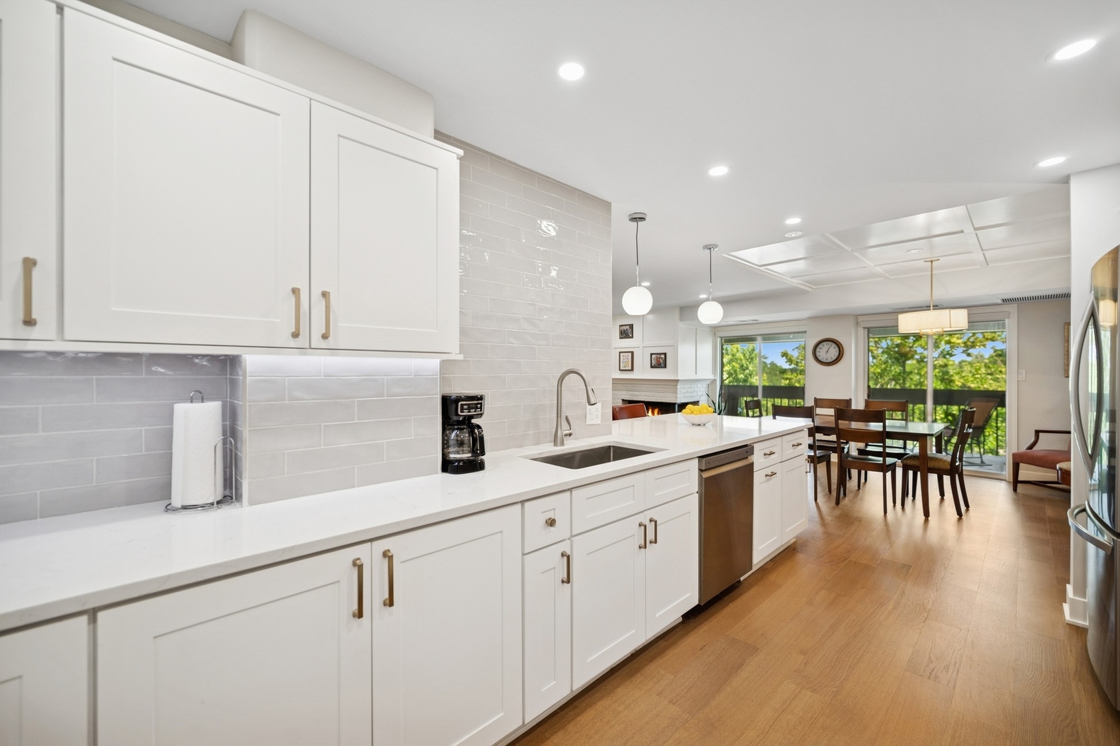 3801 Mission Hills Road, Unit 510 Northbrook, IL 60062 - Photo 9 of 19 a kitchen with white cabinets and sink
