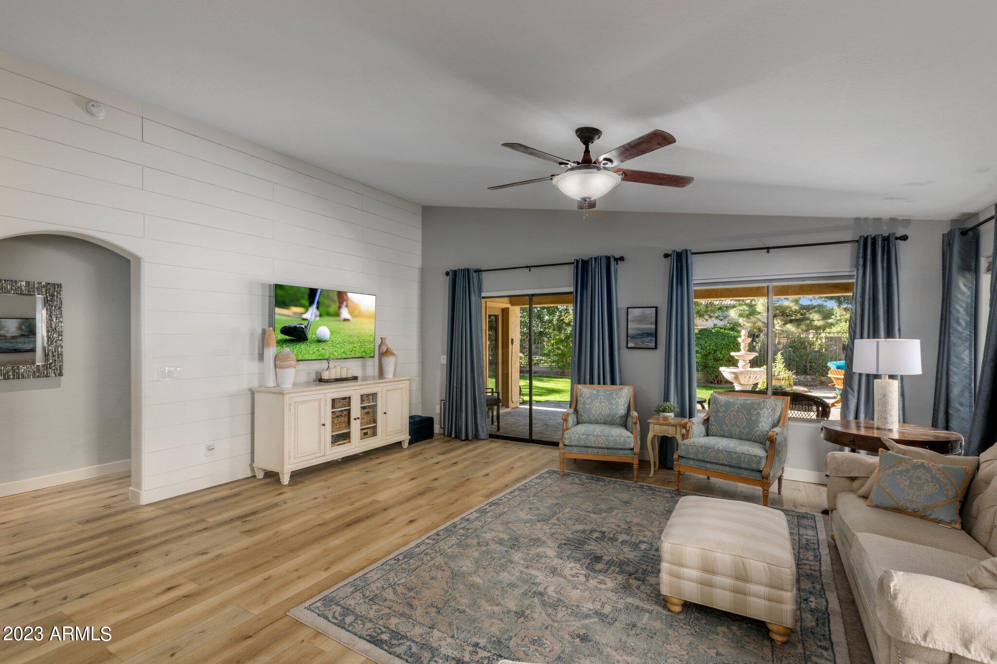 4565 East Ruffian Road Gilbert, AZ 85297 - Photo 16 of 47 a living room with furniture and a large window