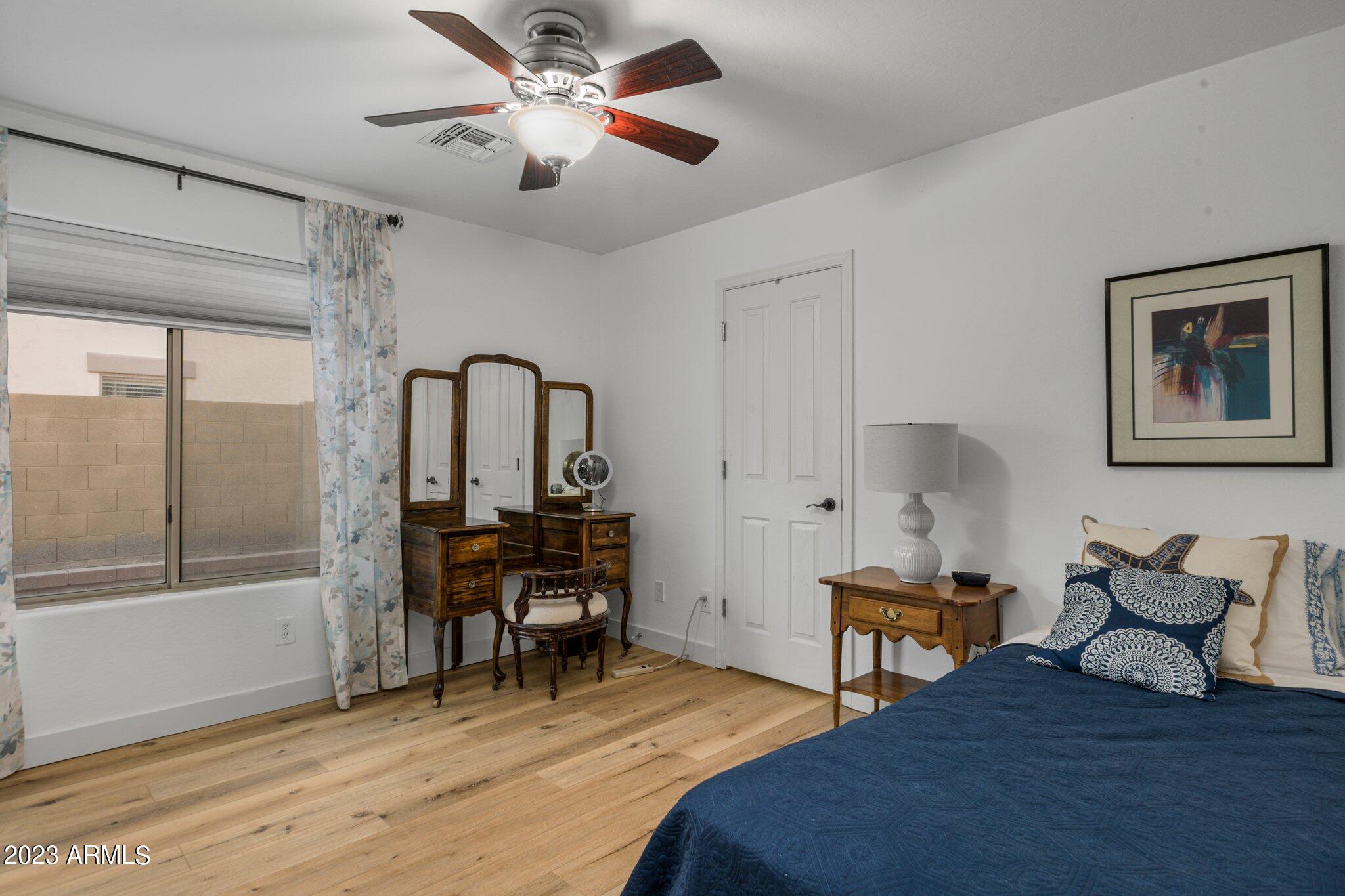 4565 East Ruffian Road Gilbert, AZ 85297 - Photo 21 of 47 a bedroom with furniture and a large window