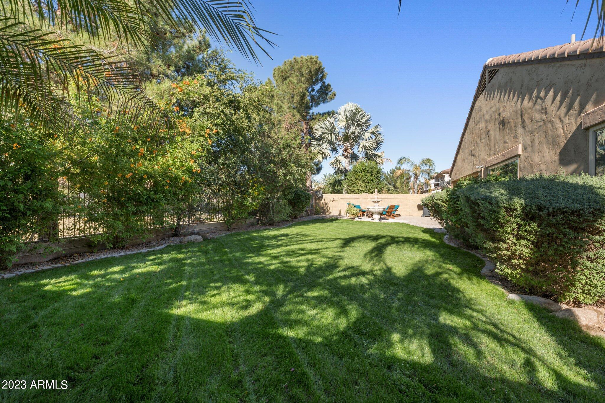 4565 East Ruffian Road Gilbert, AZ 85297 - Photo 29 of 47 a backyard of a house with lots of green space