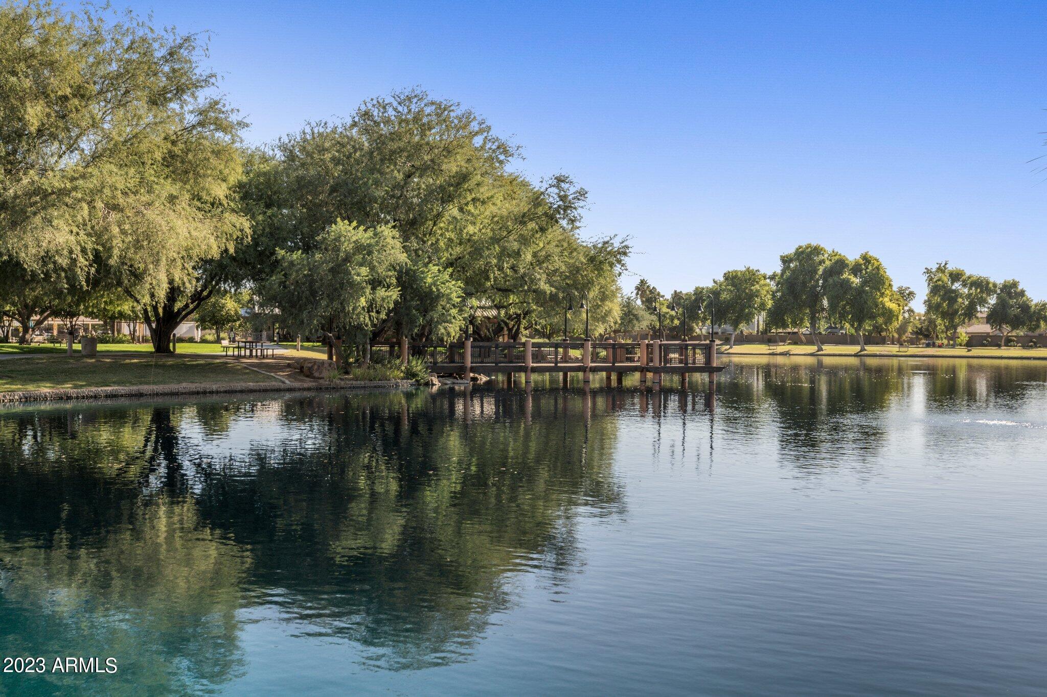 4565 East Ruffian Road Gilbert, AZ 85297 - Photo 37 of 47 a view of a lake with houses