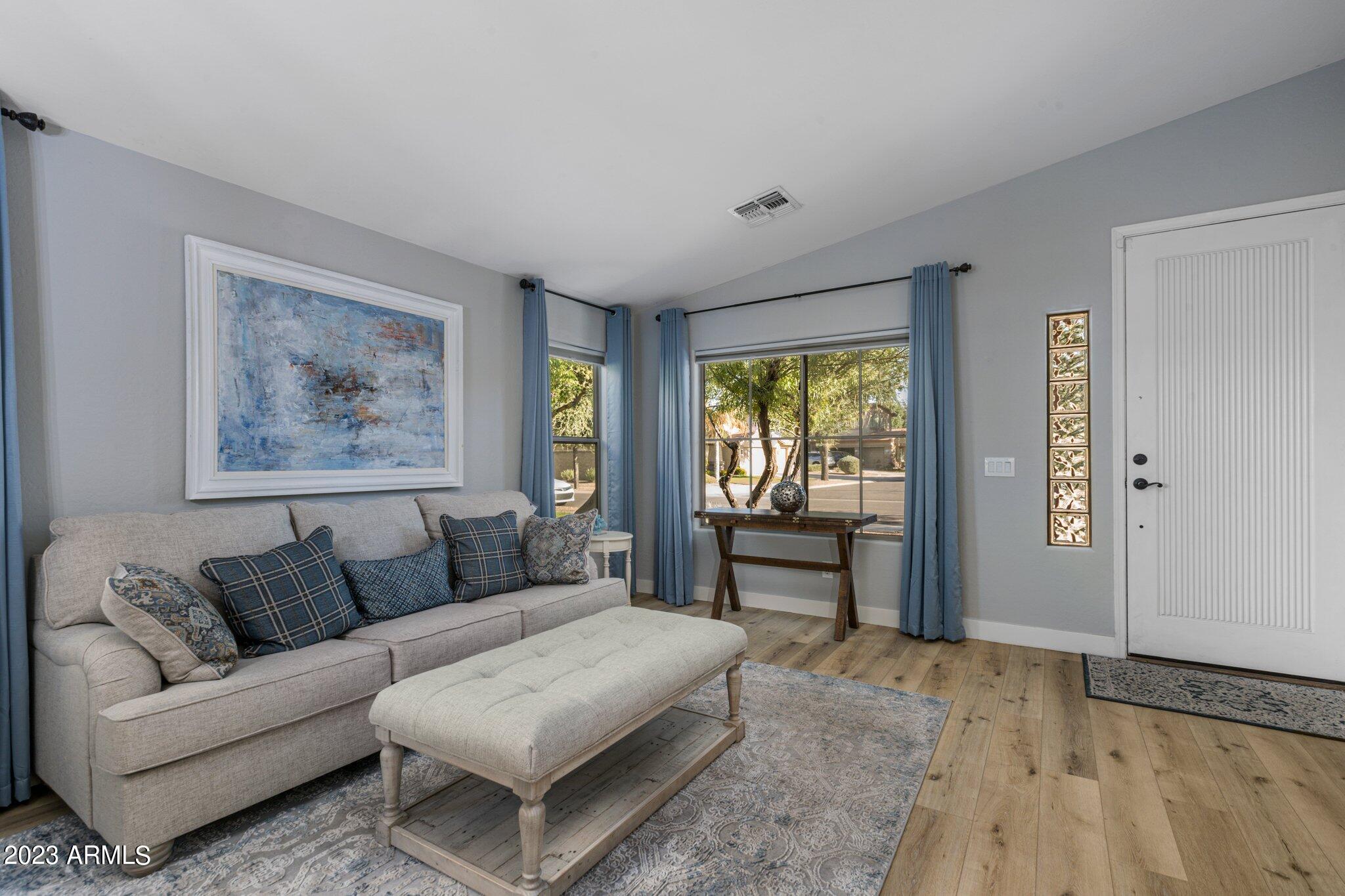 4565 East Ruffian Road Gilbert, AZ 85297 - Photo 6 of 47 a living room with furniture and a window