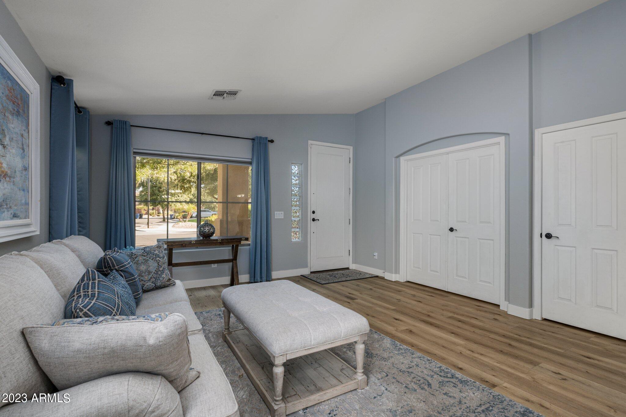 4565 East Ruffian Road Gilbert, AZ 85297 - Photo 8 of 47 a bedroom with furniture and a window