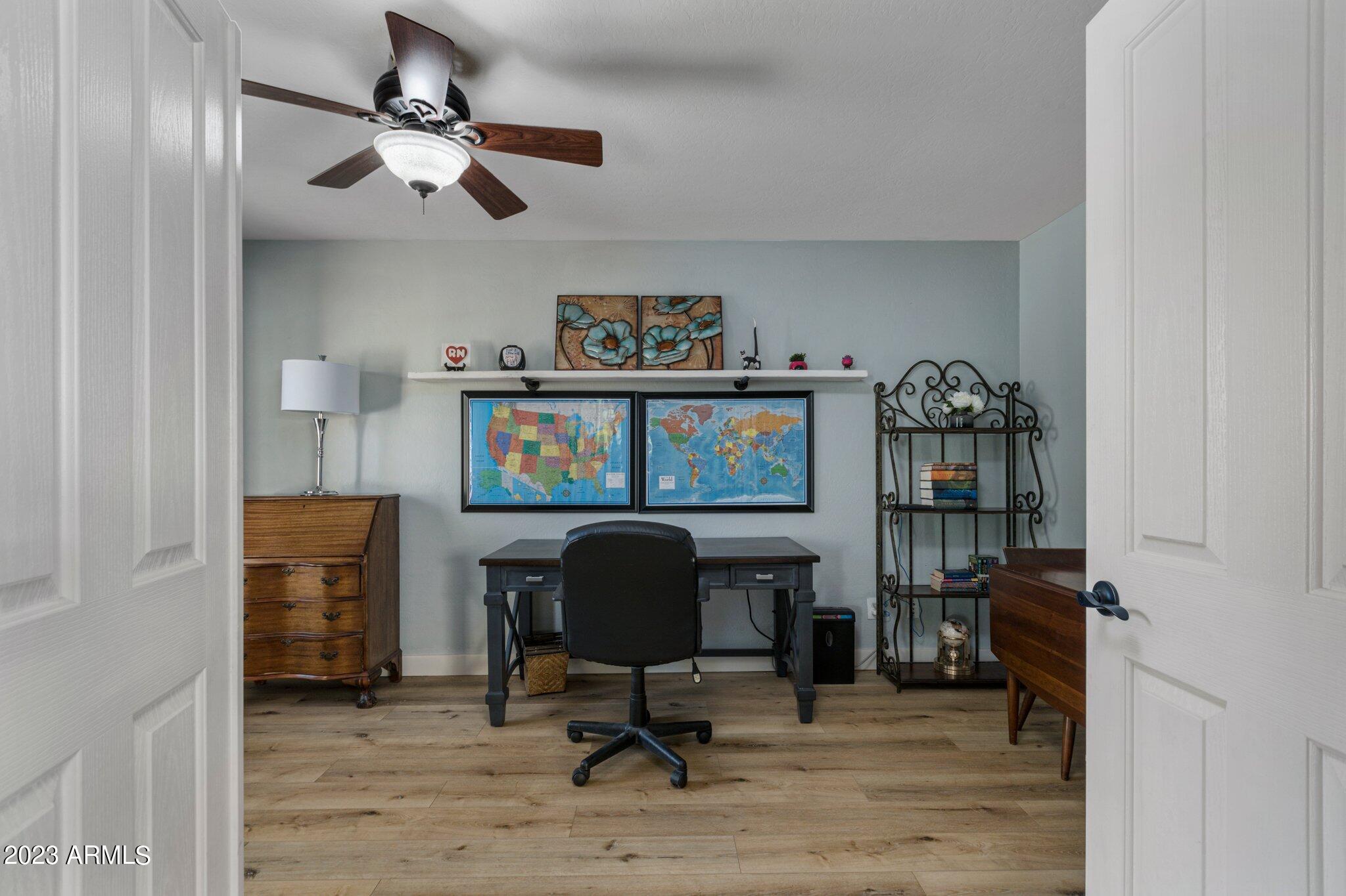 4565 East Ruffian Road Gilbert, AZ 85297 - Photo 9 of 47 a view of a workspace with furniture and a window