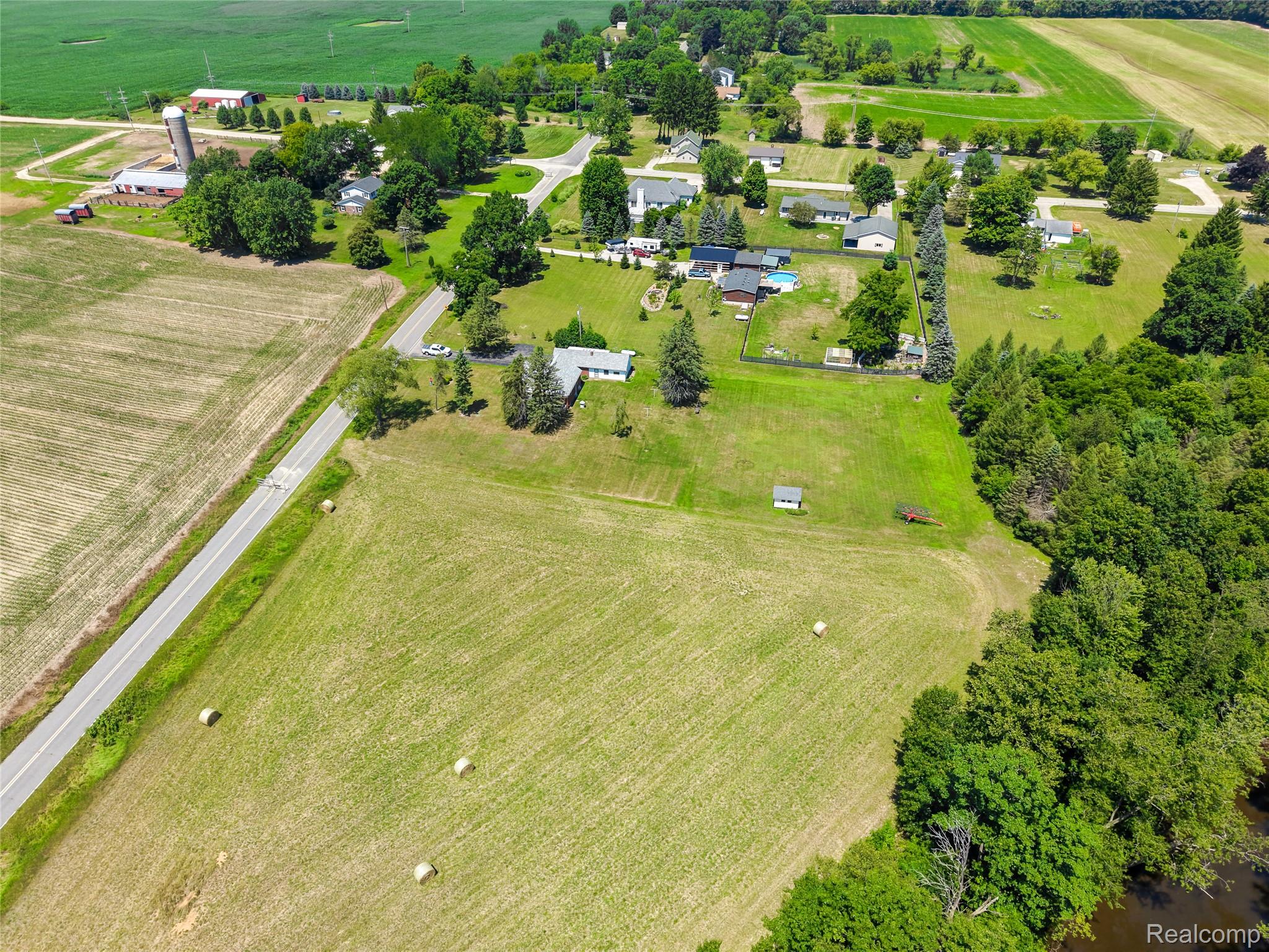 11651 South New Lothrop Road Byron, MI 48418 - Photo 16 of 19 Expansive rural property featuring a substantial land parcel, established tree lines, and proximity to agricultural fields