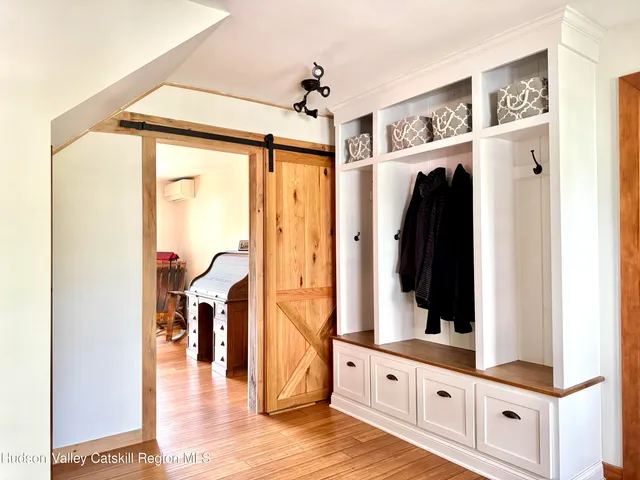 a view of a room with wooden floor
