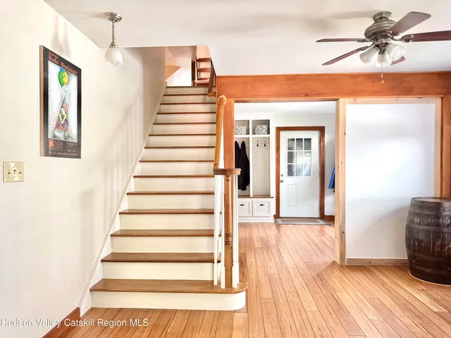 a view of a entryway door with wooden floor