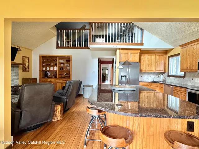 a kitchen with stainless steel appliances a stove a sink and cabinets