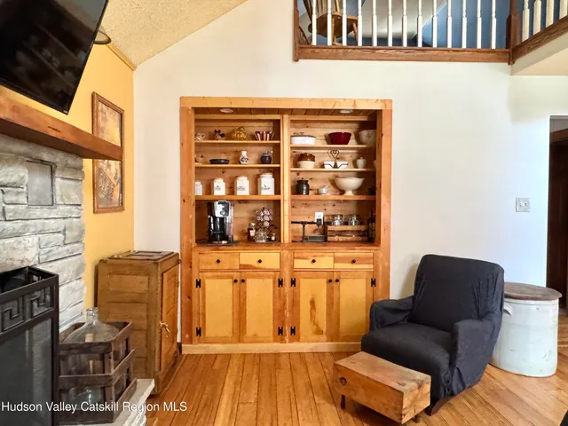 a dining room with furniture window and wooden floor