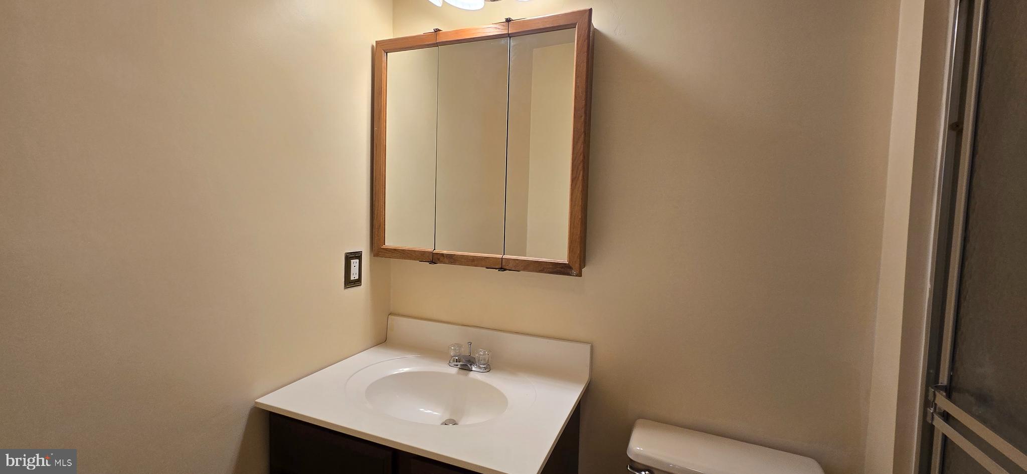 16 Dallington Court Perry Hall, MD 21128 - Photo 20 of 29 a bathroom with a sink a toilet and mirror