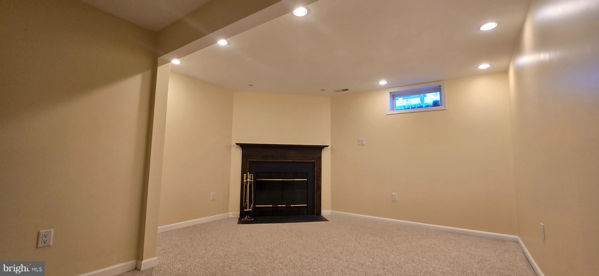 16 Dallington Court Perry Hall, MD 21128 - Photo 25 of 29 a view of an empty room with a cabinet and a ceiling fan