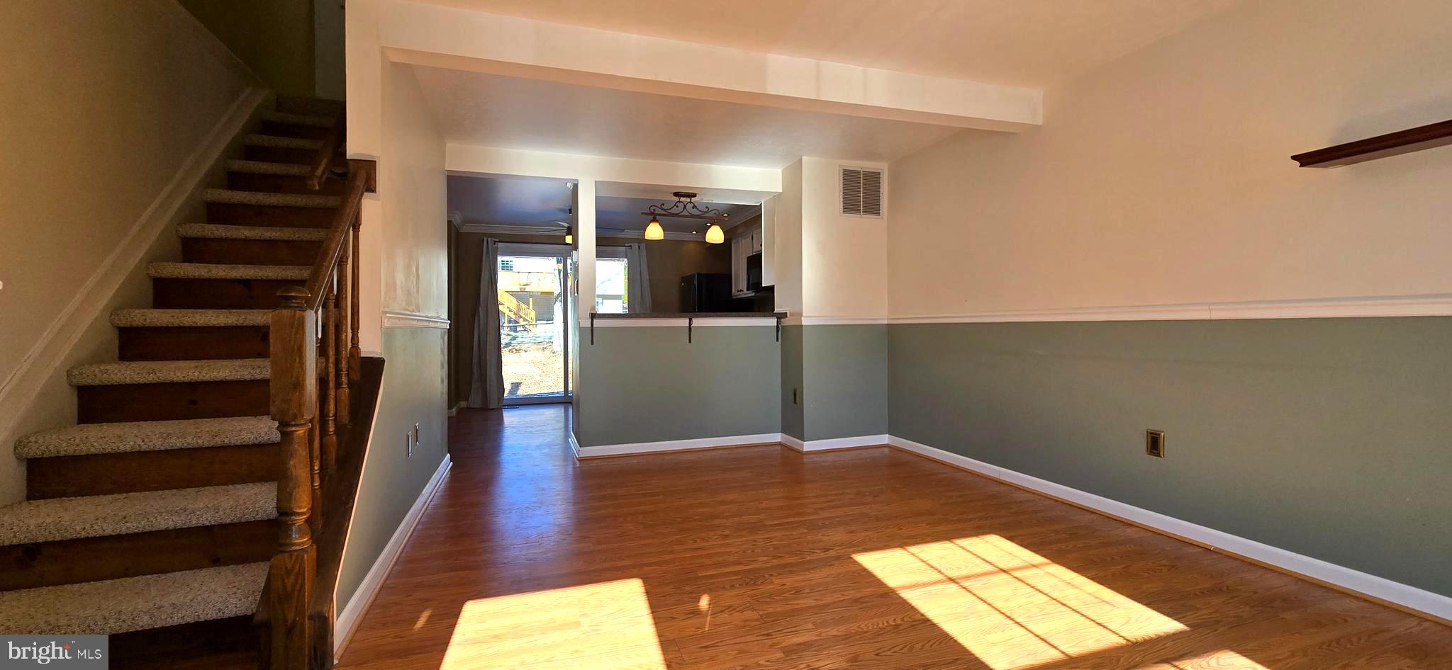 16 Dallington Court Perry Hall, MD 21128 - Photo 4 of 29 a view of a hallway with wooden floor and staircase