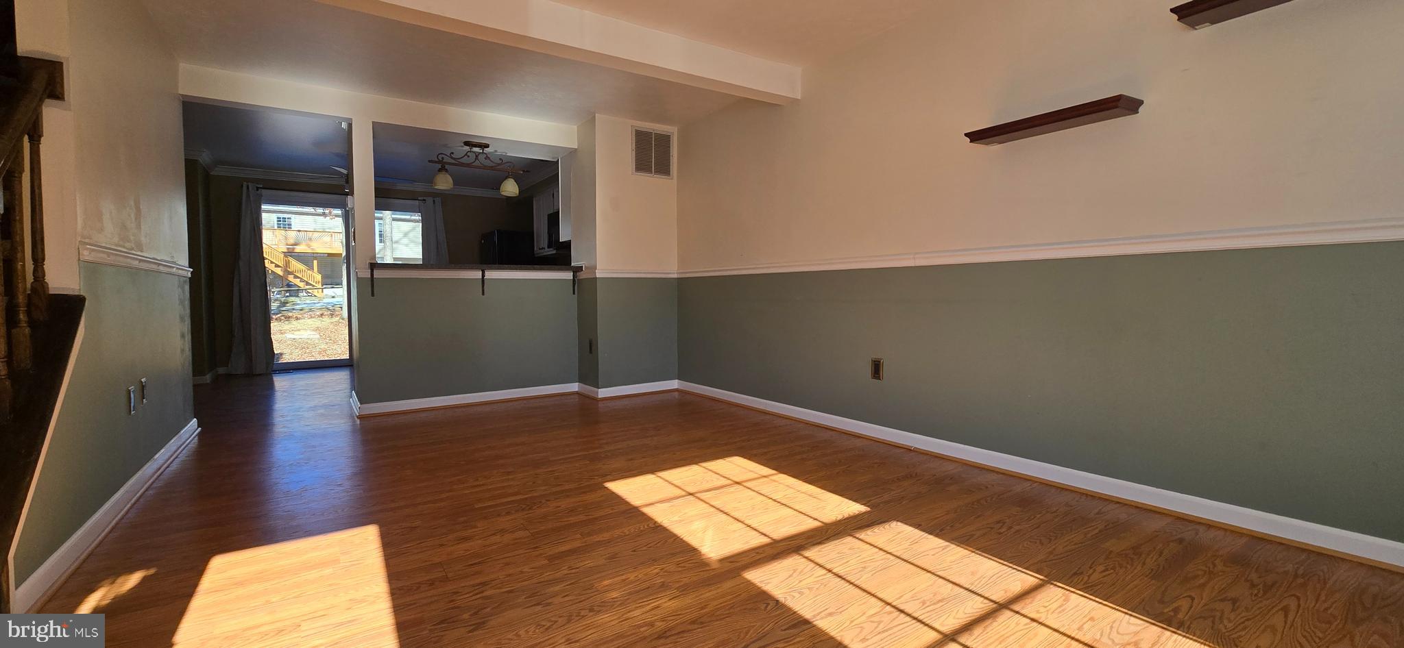 16 Dallington Court Perry Hall, MD 21128 - Photo 6 of 29 wooden floor in an empty room with a window
