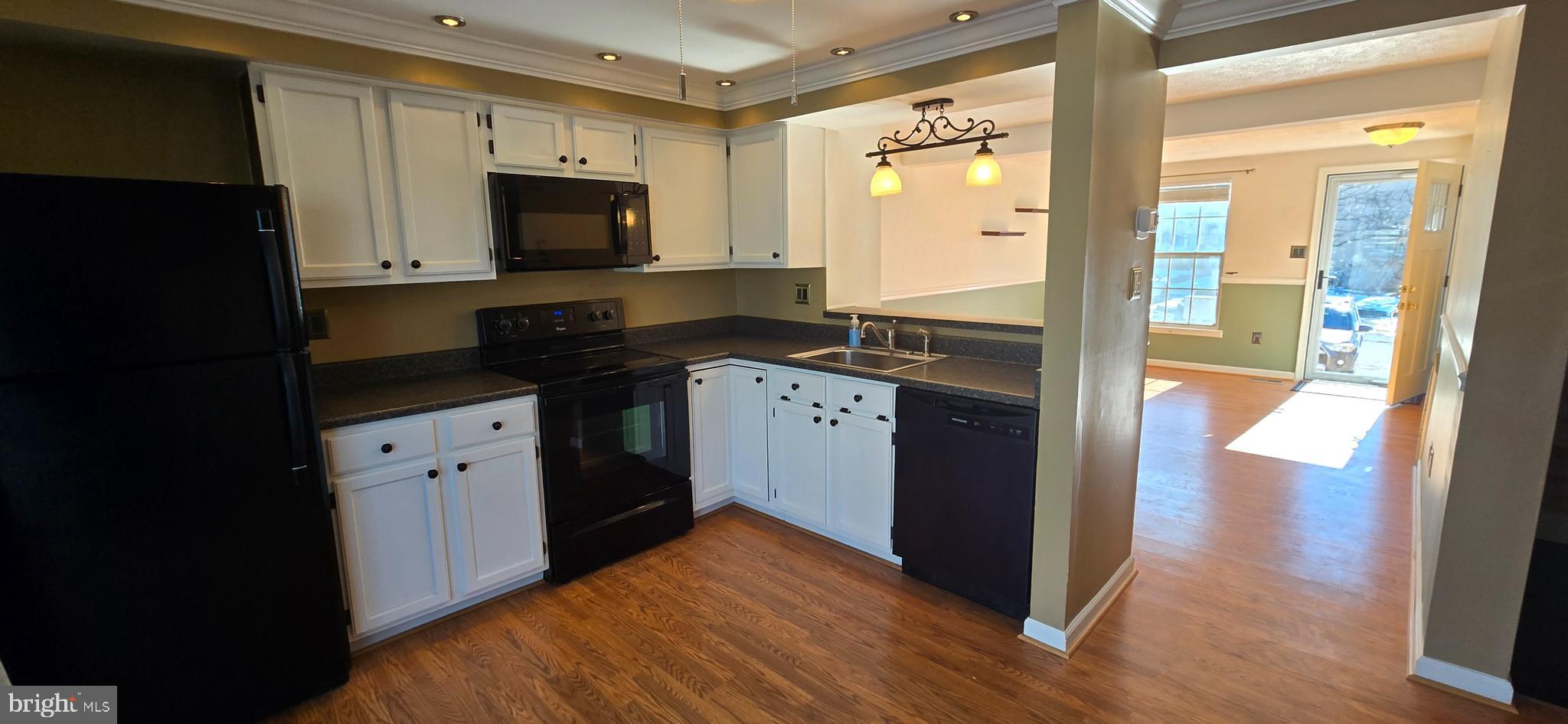 16 Dallington Court Perry Hall, MD 21128 - Photo 7 of 29 a kitchen with granite countertop a refrigerator stove and sink