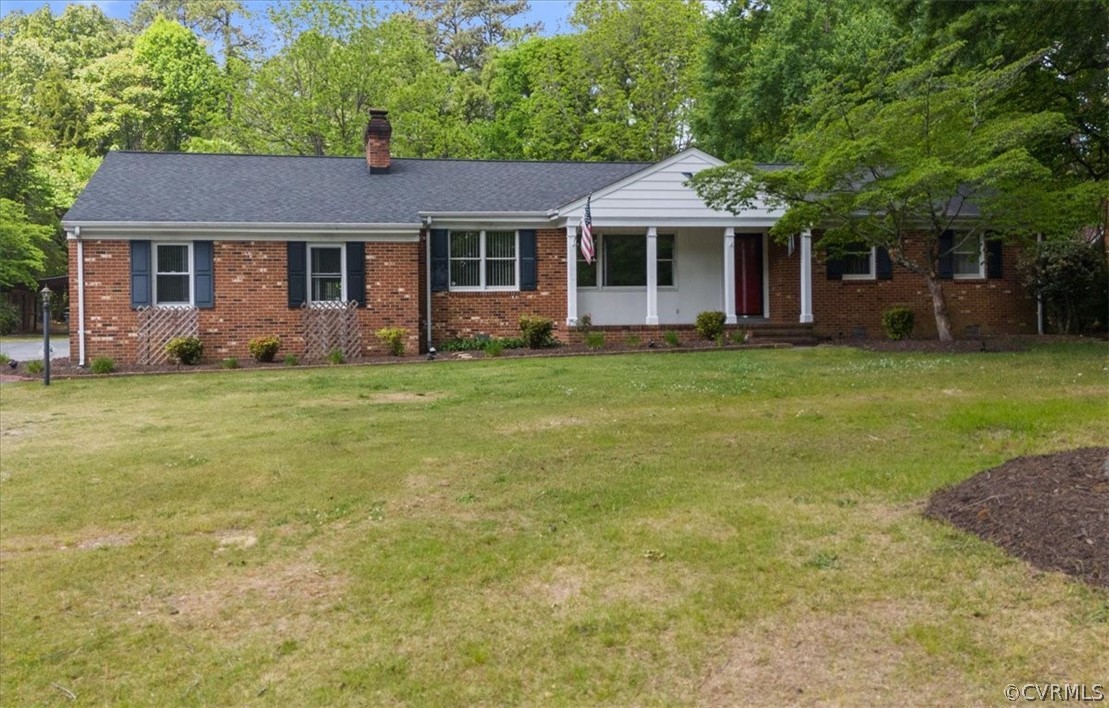 13012 Harrowgate Road Chester, VA 23831 - Photo 1 of 28 a front view of a house with a garden