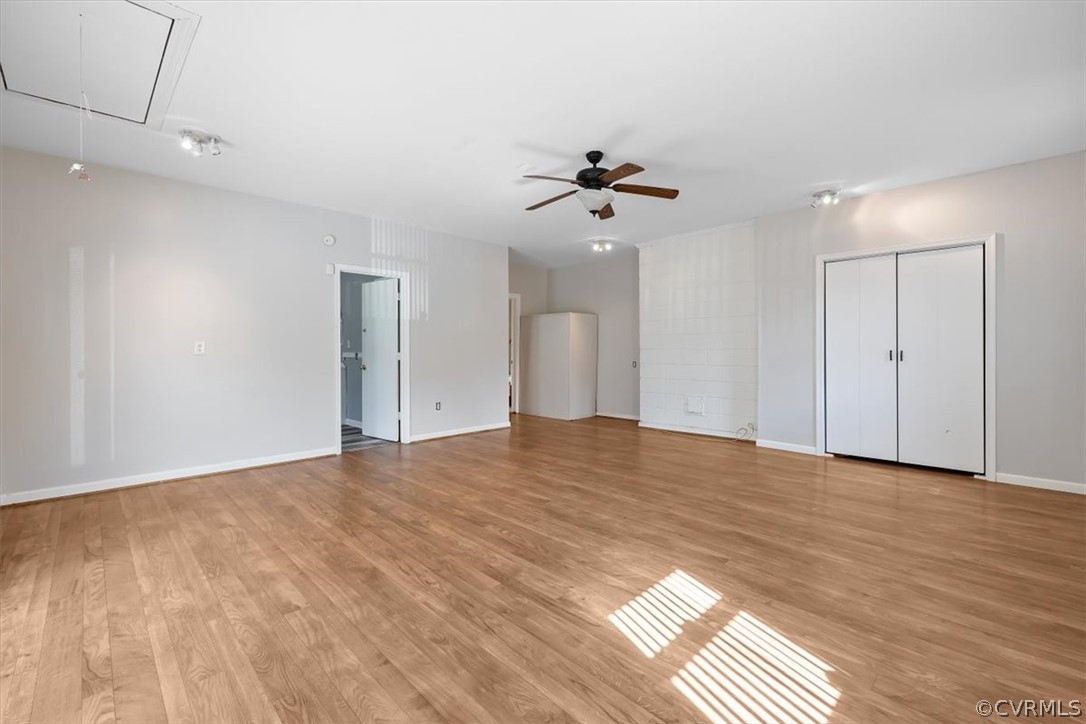 13012 Harrowgate Road Chester, VA 23831 - Photo 21 of 28 a view of empty room with wooden floor and fan