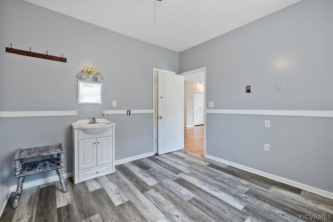 13012 Harrowgate Road Chester, VA 23831 - Photo 23 of 28 a room with a white bed furniture and a window
