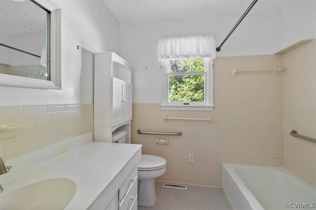 13012 Harrowgate Road Chester, VA 23831 - Photo 25 of 28 a bathroom with a sink a toilet and shower