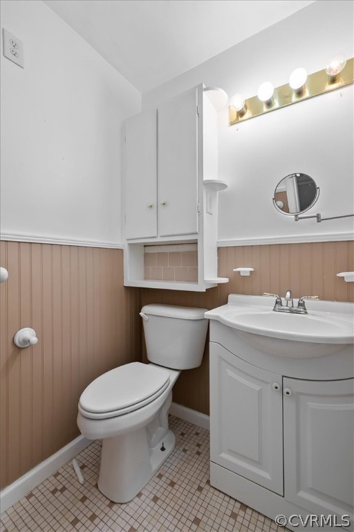 13012 Harrowgate Road Chester, VA 23831 - Photo 28 of 28 a bathroom with a toilet a sink and mirror