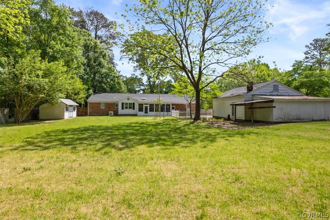 13012 Harrowgate Road Chester, VA 23831 - Photo 6 of 28 a front view of house with yard and trees