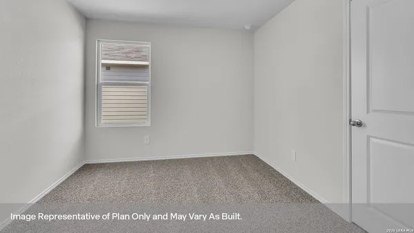 a view of an empty room and a window