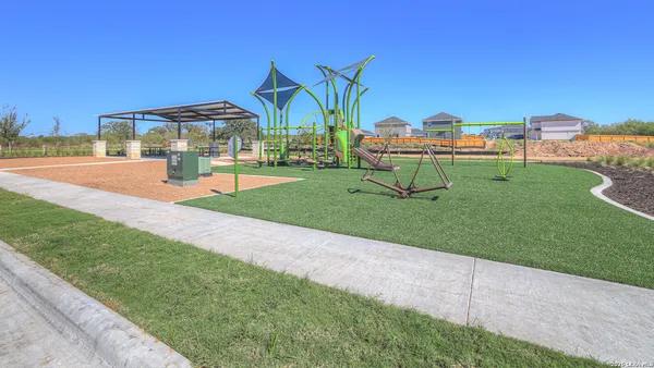 a view of a park with a slide