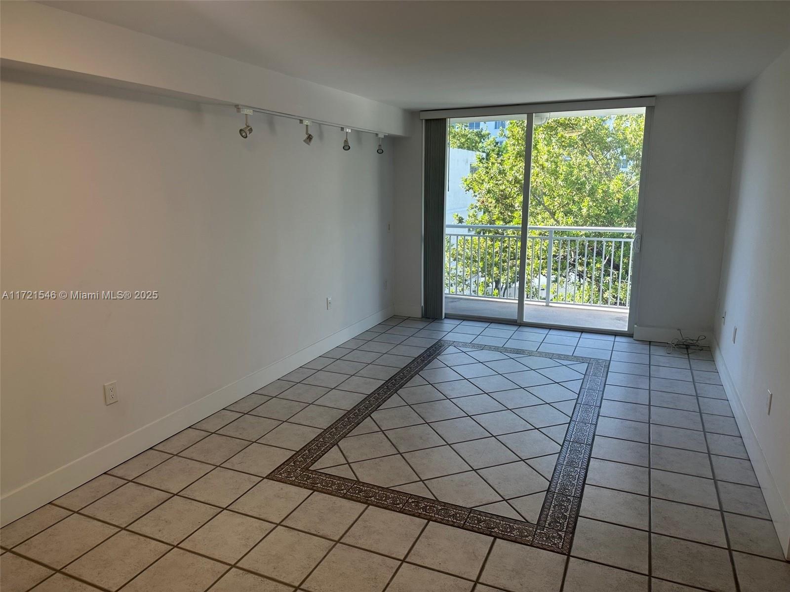 1666 West Avenue, Unit 512 Miami Beach, FL 33139 - Photo 15 of 20 a view of an empty room and window