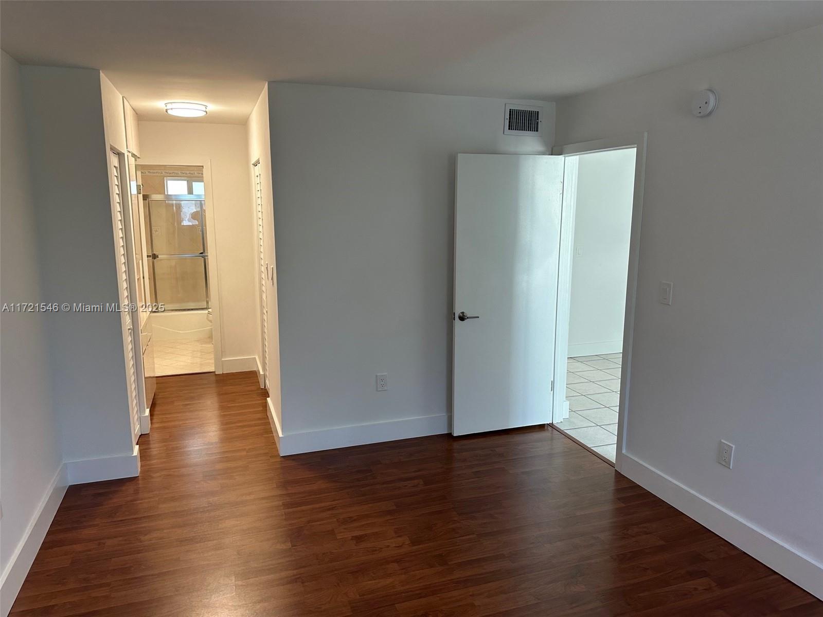 1666 West Avenue, Unit 512 Miami Beach, FL 33139 - Photo 16 of 20 a view of empty room with wooden floor